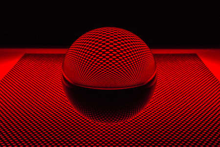 Glass ball with perforated plateの写真素材