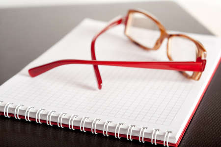 Spectacles and a jotterの写真素材