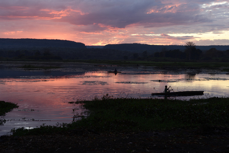 Fishermen at dawn in Manambolo river, Tsingy de Bemaraha National Park. Bekopaka, Mahajanga province, Madagascarの写真素材