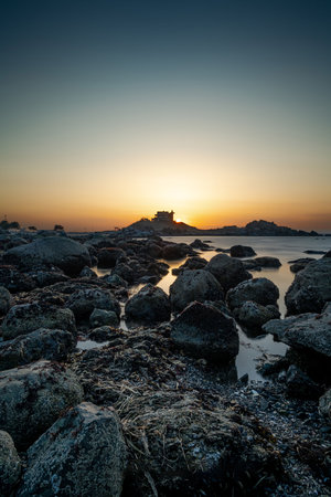 The setting sun behind Kabushima Shrine. Aomori prefecture in Japanの写真素材