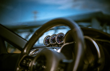 View on the steering wheel and dashboard of a vintage car. Retro style.の写真素材