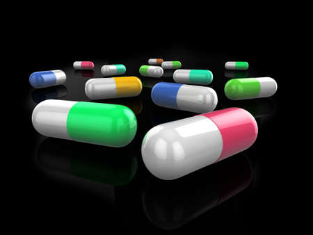 Illustration of glossy coloured (colored) pills on a slightly reflective black surface.の写真素材