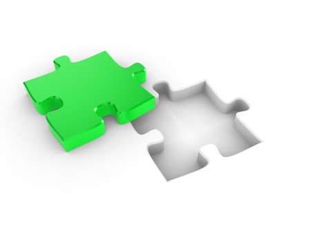 The missing piece of a puzzle, fitting into placeの写真素材