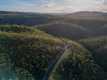 Aerial view of tropical remote road in Far North Queensland with a sunsetの写真素材