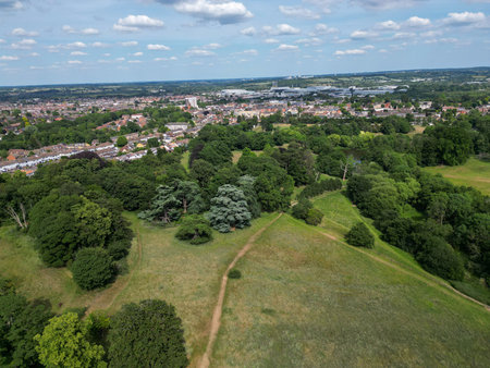 Aerial view of park and woodland showing fields, housing estates and nature inの写真素材