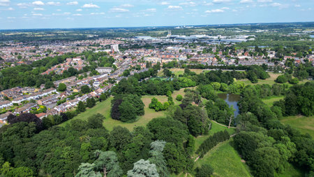 Aerial view of park and woodland showing fields, housing estates and natureの写真素材