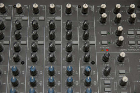 closeup view of a DJ's mixing desk with shallow depth of field