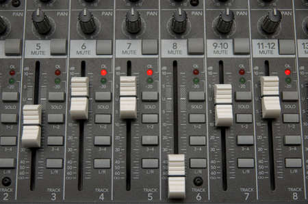 closeup view of a DJ's mixing desk with shallow depth of field
