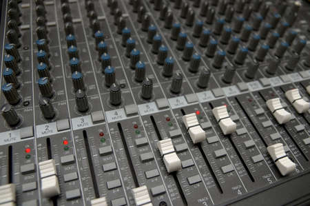 closeup view of a DJ's mixing desk with shallow depth of field