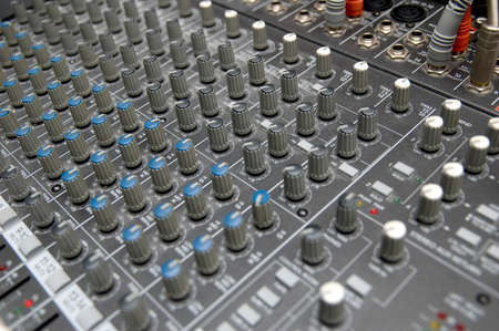 closeup view of a DJ's mixing desk with shallow depth of field