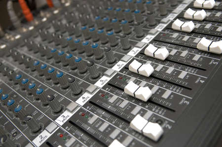 closeup view of a DJ's mixing deskの写真素材