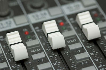closeup view of a DJ's mixing deskの写真素材