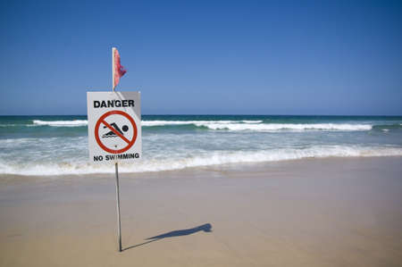 warning sign on a beachの写真素材