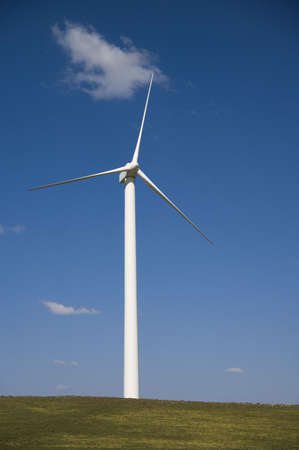 wind turbine against a blue sky backgroundの写真素材