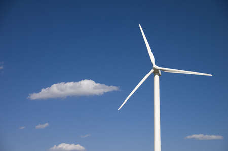 wind turbine against a blue sky backgroundの写真素材