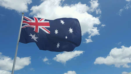 Australian flag against a cloudy blue sky