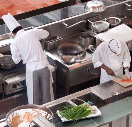 two chefs preparing for the evening meal at resortの写真素材