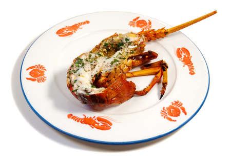 baked lobster on a plate with shellfish patternsの写真素材