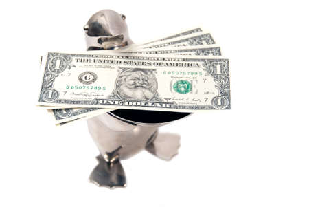 penguin bearing gifts of limited edition legal tender us dollar notes with santa's pictureの写真素材