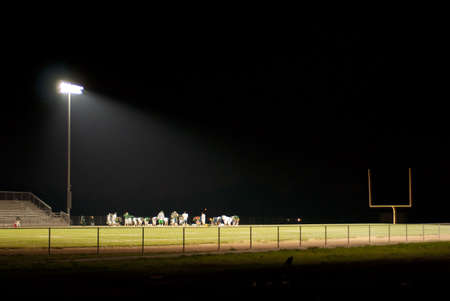 stadium light shines brightly on the fieldの写真素材