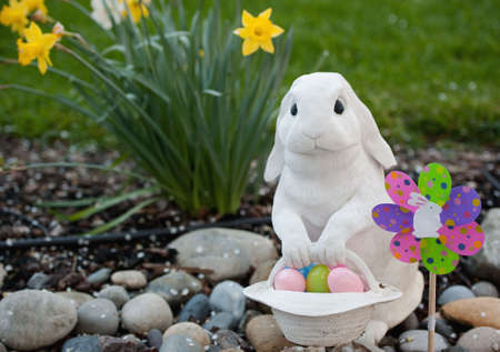 white rabbit with a basket of easter eggsの写真素材
