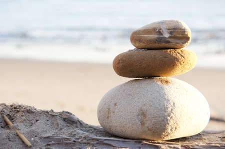 balance and tranquility against ocean wavesの写真素材