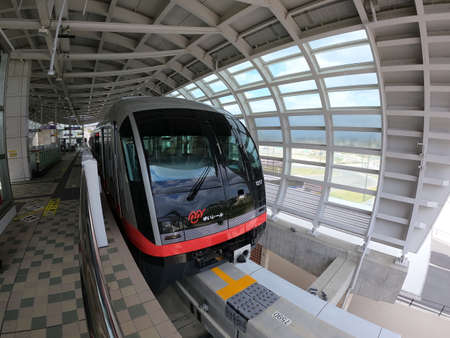 Train stops at Tedako Uranishi Station at Yui Rail New Station in Okinawaのeditorial素材