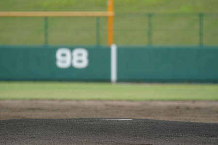 A mound of fresh ground at a baseball stadium before a baseball game.
