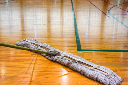 Floor mopping before basketball game with court set upの写真素材