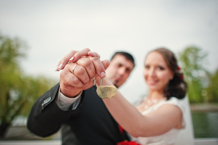 hands wedding couple with lock and ringsの写真素材