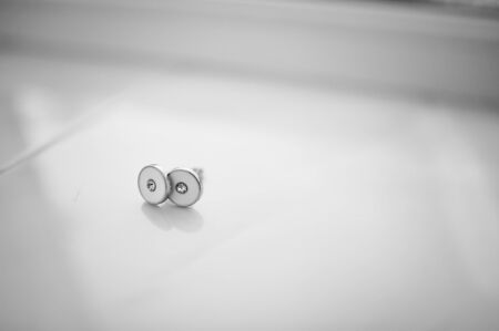 groom cufflinks on white backgroundの写真素材