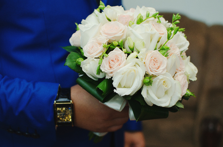wedding bouquet on hands of brideの写真素材