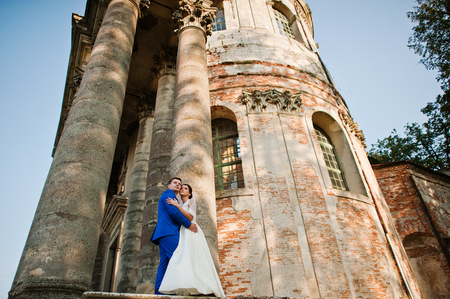 Young wedding couple on background old castleの写真素材