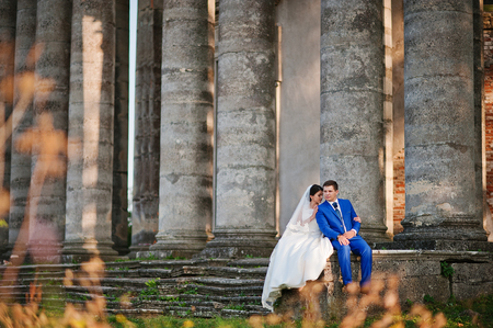 Young wedding couple on background old castleの写真素材