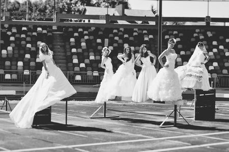 brides on the football  podiumの写真素材