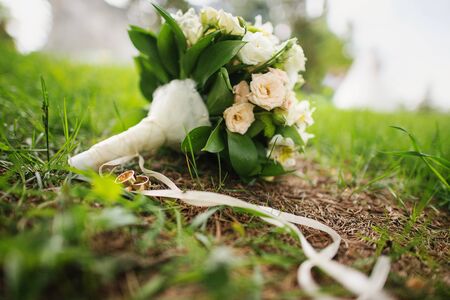 wedding bouquet at green grassの写真素材