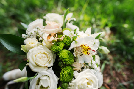 wedding bouquet at green grassの写真素材