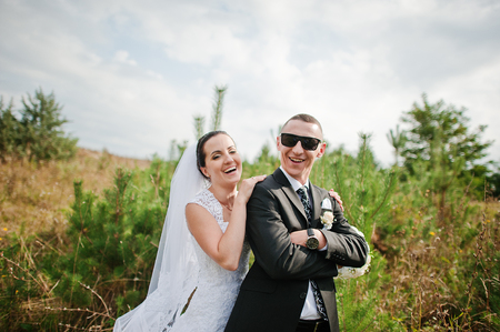 Yong brunette married couple at pinewood in loveの写真素材