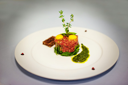 meat and raw eggs  isolated on white backgroundの写真素材