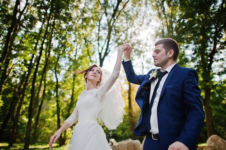 Dancing wedding couple background big stonesの写真素材