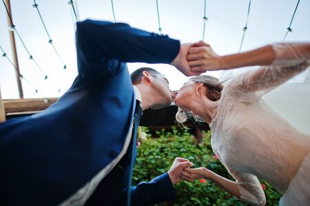 wedding couple sitting at pubの写真素材