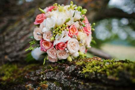 wedding bouquet with rings on treeの写真素材