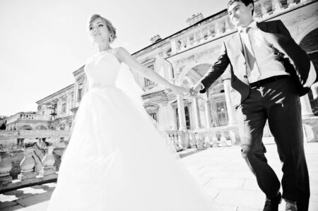 Tender wedding couple background old architecture of castleの写真素材