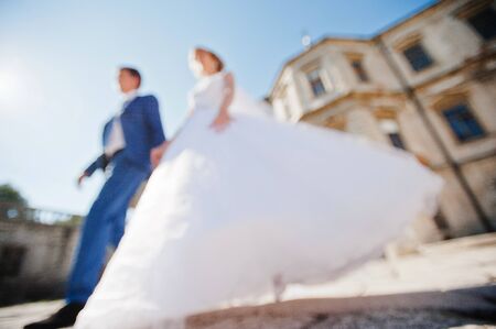 Tender wedding couple background old architecture of castleの写真素材
