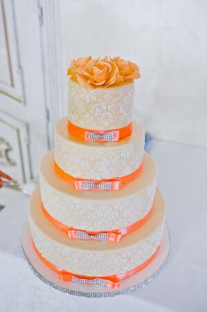 Great wedding cake with orange ribbonsの写真素材