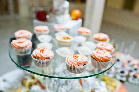 sweet candies and cupcakes on wedding receptionの写真素材