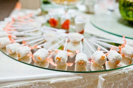 sweet candies and cupcakes on wedding receptionの写真素材