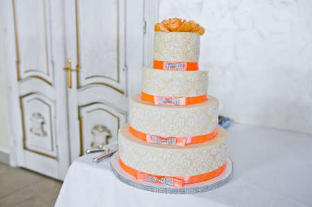 Great wedding cake with orange ribbonsの写真素材