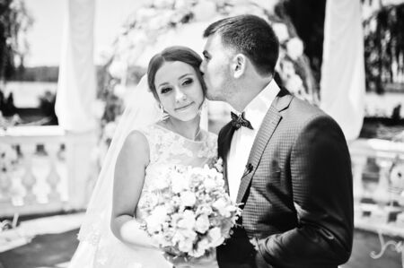 happy fashionable wedding couple on wedding ceremony of registrationの写真素材