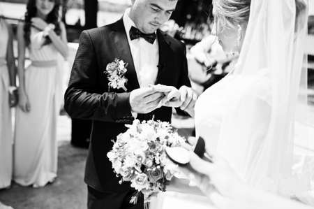 happy fashionable wedding couple on wedding ceremony of registrationの写真素材